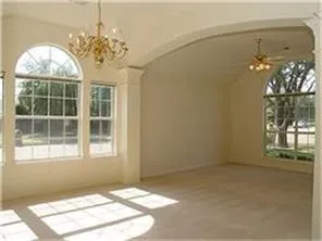 a large bathroom with a granite countertop tub sink and mirror