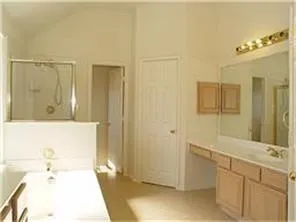 a bathroom with a bathtub and a sink