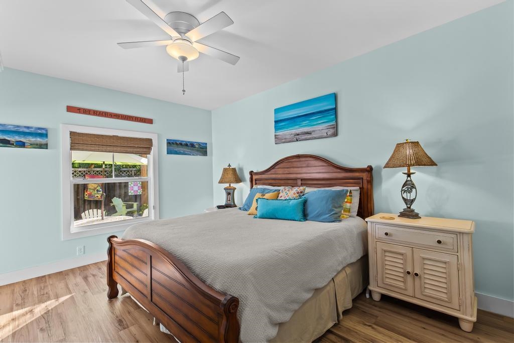 311 E Street St. Augustine, FL 32080 - Photo 14 of 39 a bedroom with a bed and a chandelier