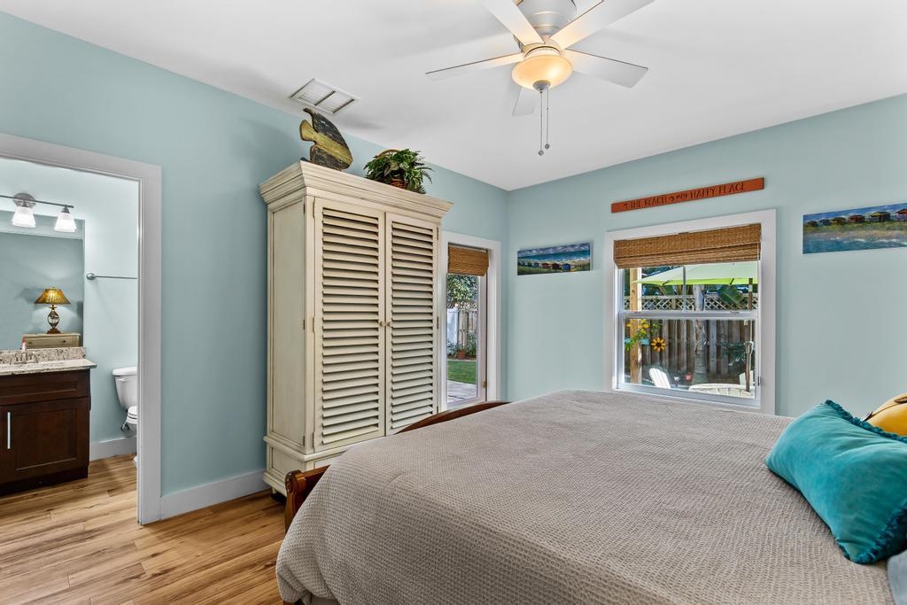 311 E Street St. Augustine, FL 32080 - Photo 15 of 39 a bedroom with a bed and a chandelier