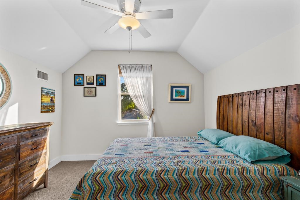 311 E Street St. Augustine, FL 32080 - Photo 17 of 39 a bedroom with a bed and a window