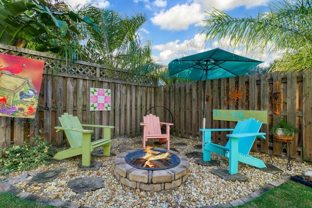 311 E Street St. Augustine, FL 32080 - Photo 28 of 39 a backyard of a house with table and chairs