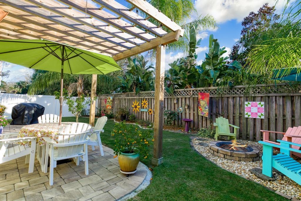 311 E Street St. Augustine, FL 32080 - Photo 29 of 39 a view of a chair and table under an umbrella