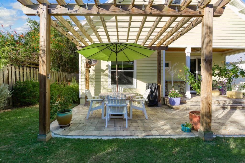 311 E Street St. Augustine, FL 32080 - Photo 31 of 39 a view of a chair and table in backyard of the house