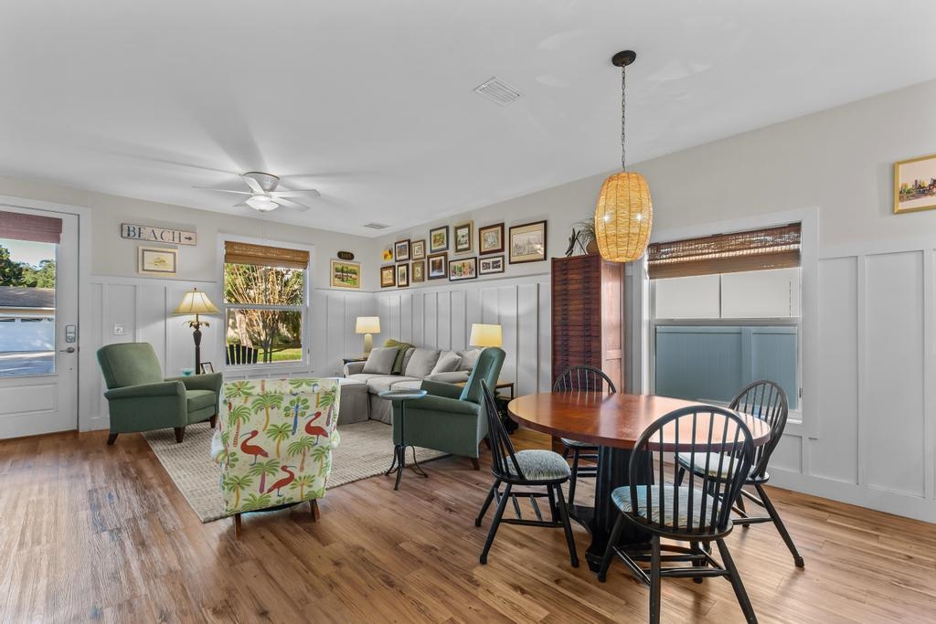 311 E Street St. Augustine, FL 32080 - Photo 8 of 39 a view of a dining room with furniture window and wooden floor