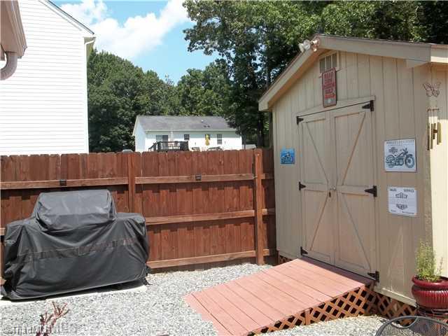 203 Falcon Road Gibsonville, NC 27249 - Photo 12 of 16 Storage. Wired Storage building for additional storage or Workshop.