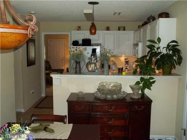 203 Falcon Road Gibsonville, NC 27249 - Photo 6 of 16 Dining Room. Open View from Dining Area to Kitchen.