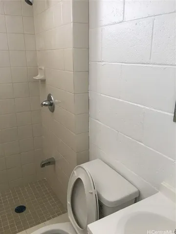 a bathroom with a bathtub and shower