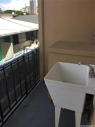 a view of balcony with furniture