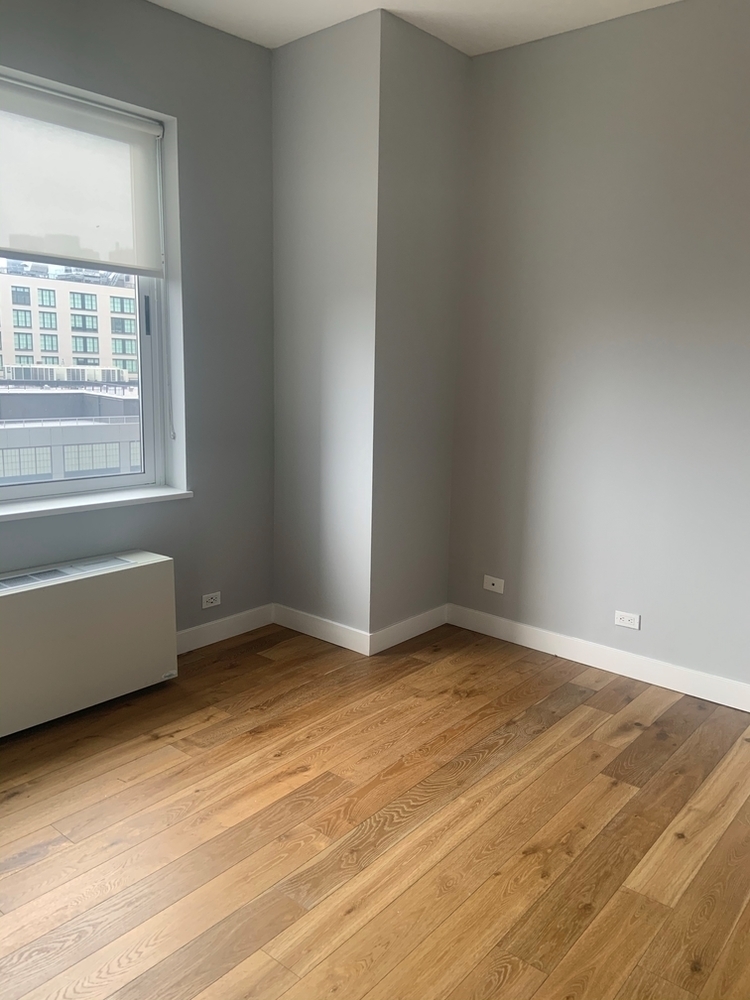 560 West 43rd Street, Unit 9K Manhattan, NY 10036 - Photo 5 of 19 an empty room with a window