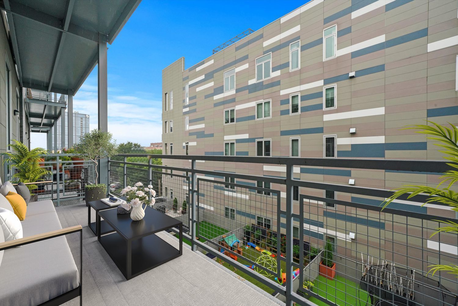 122 South Aberdeen Street, Unit 5N Chicago, IL 60607 - Photo 14 of 23 a view of a balcony with couches and potted plants