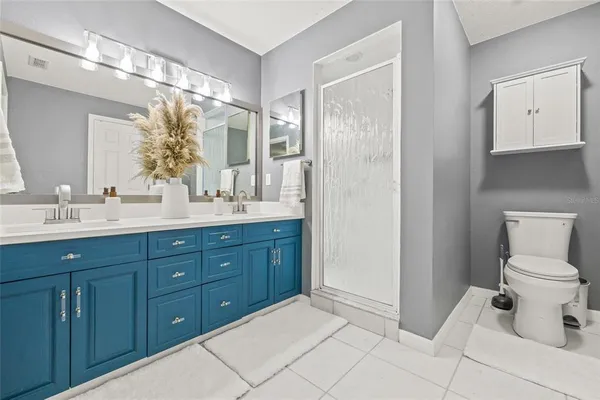 a view of walk in closet with clothes