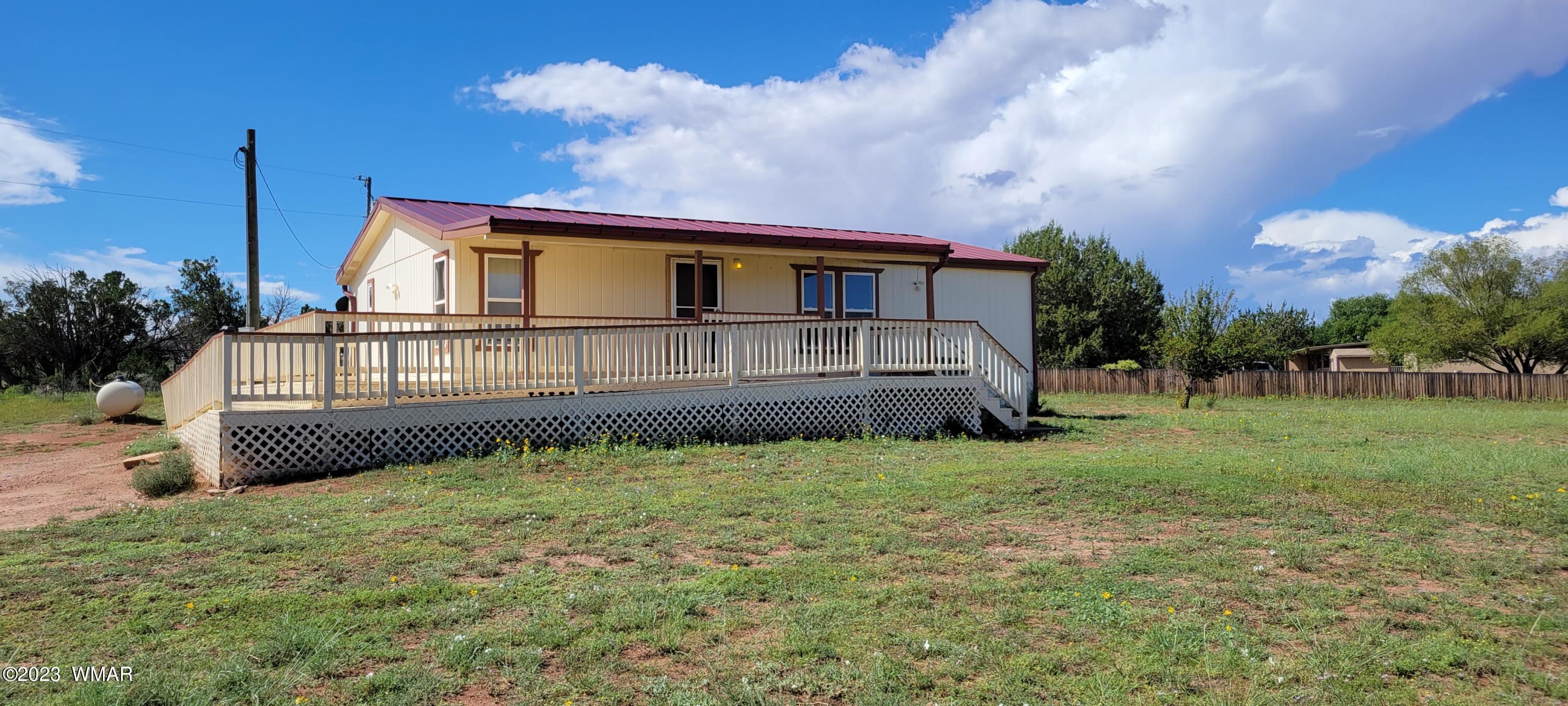 4732 Norris Road Snowflake, AZ 85937 - Photo 1 of 67 a house with green field in front of it