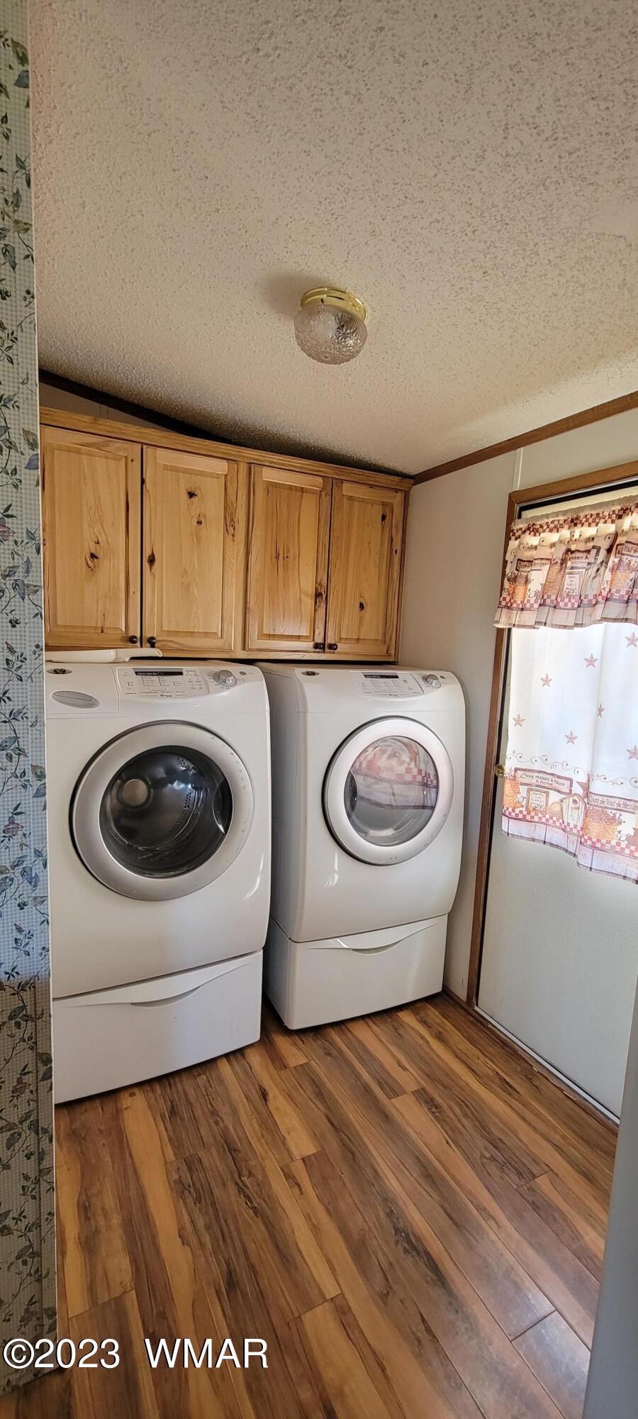 4732 Norris Road Snowflake, AZ 85937 - Photo 12 of 67 a view of a storage and utility room with washer and dryer