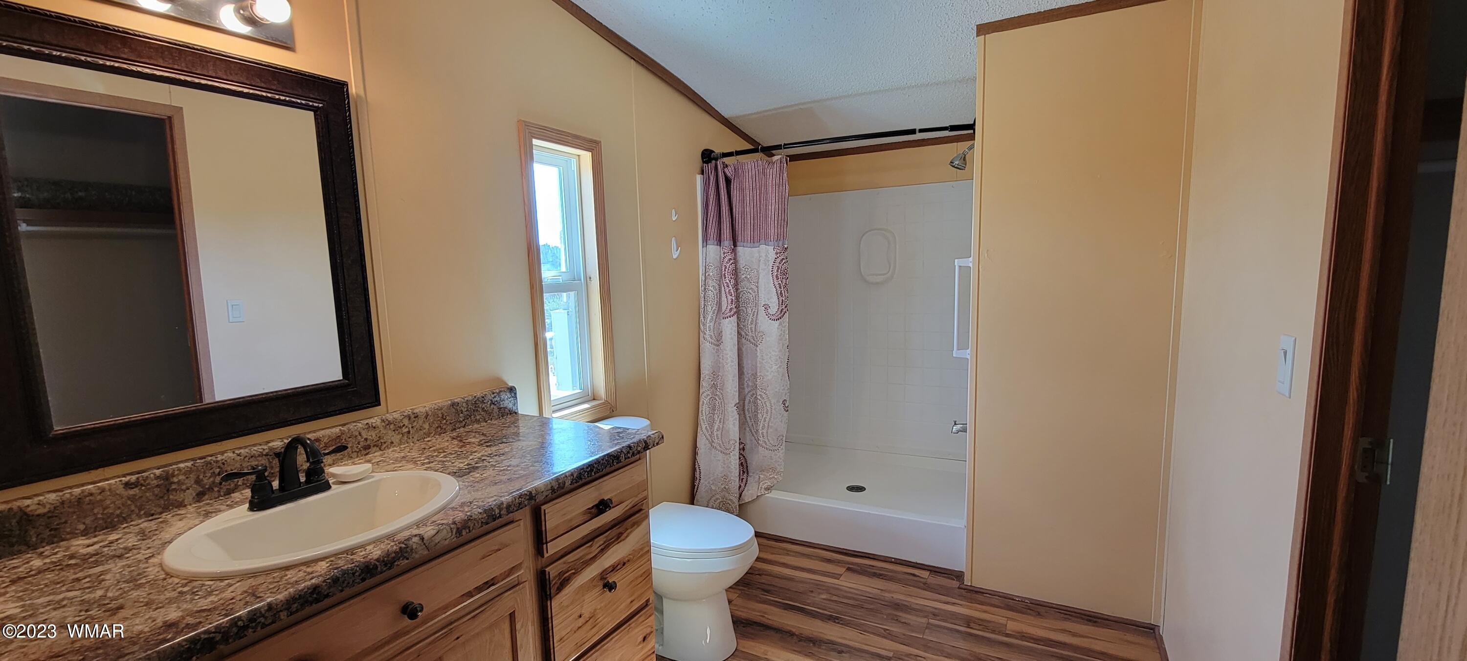 4732 Norris Road Snowflake, AZ 85937 - Photo 18 of 67 a bathroom with a granite countertop sink toilet and shower