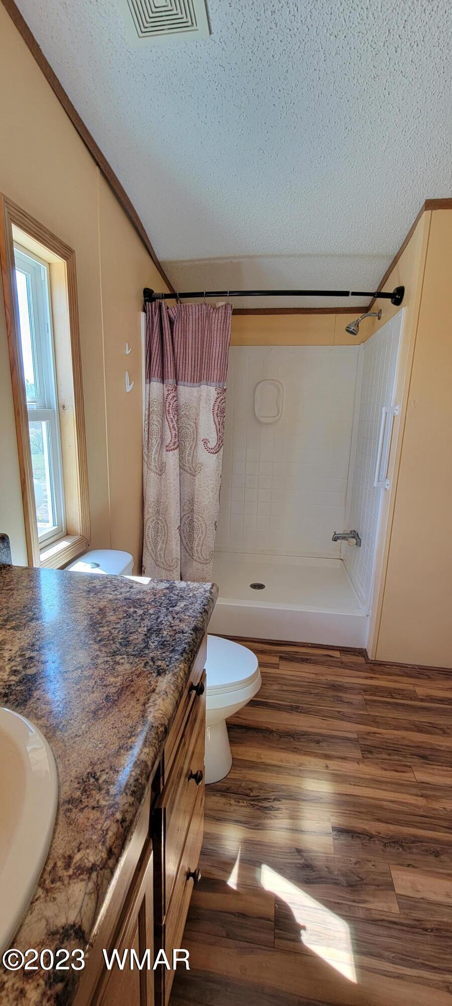4732 Norris Road Snowflake, AZ 85937 - Photo 20 of 67 a bathroom with a granite countertop sink toilet and shower