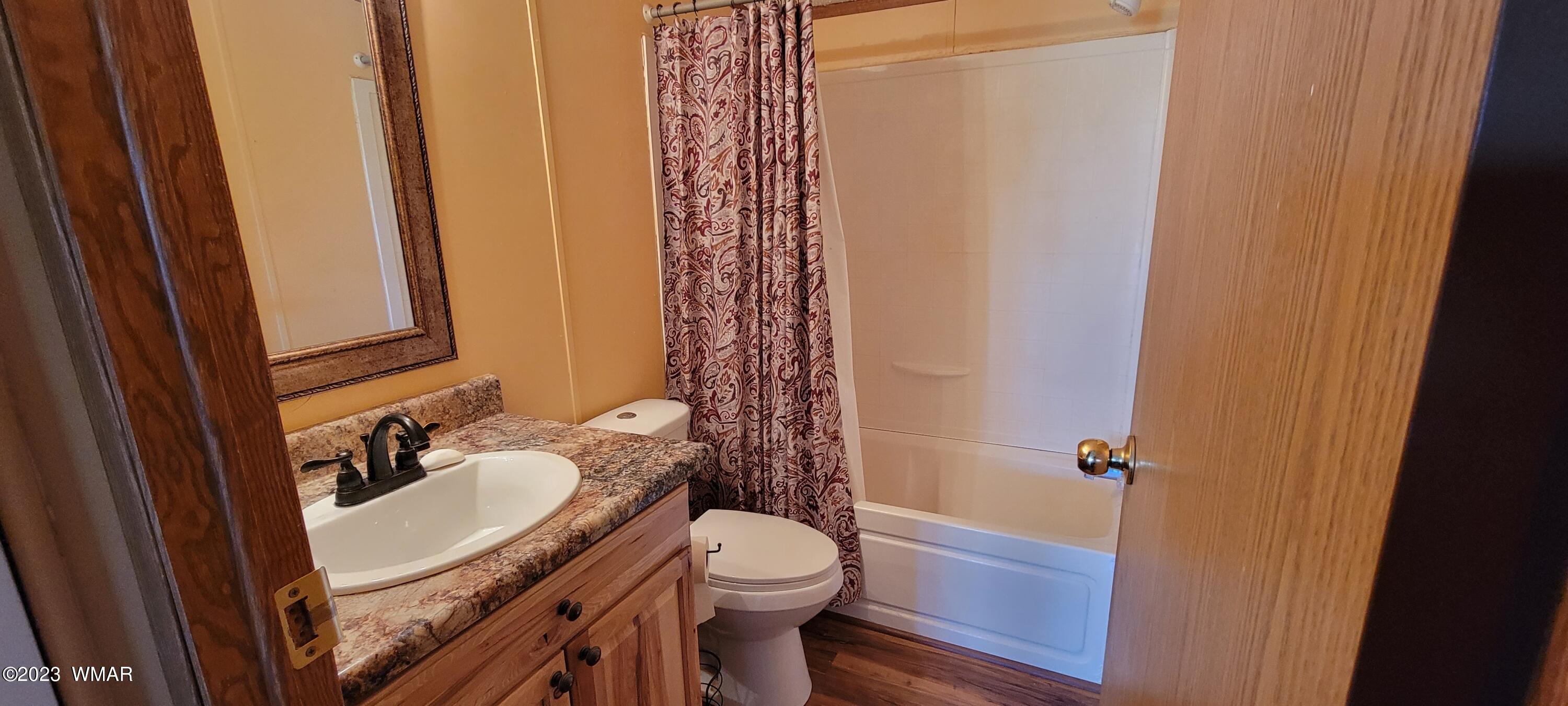 4732 Norris Road Snowflake, AZ 85937 - Photo 24 of 67 a bathroom with a granite countertop sink toilet and shower