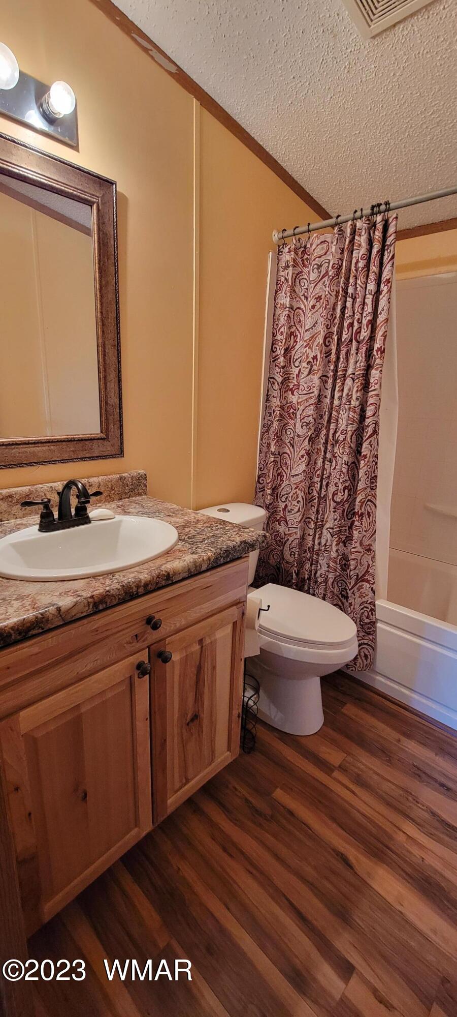 4732 Norris Road Snowflake, AZ 85937 - Photo 25 of 67 a bathroom with a granite countertop sink toilet and shower