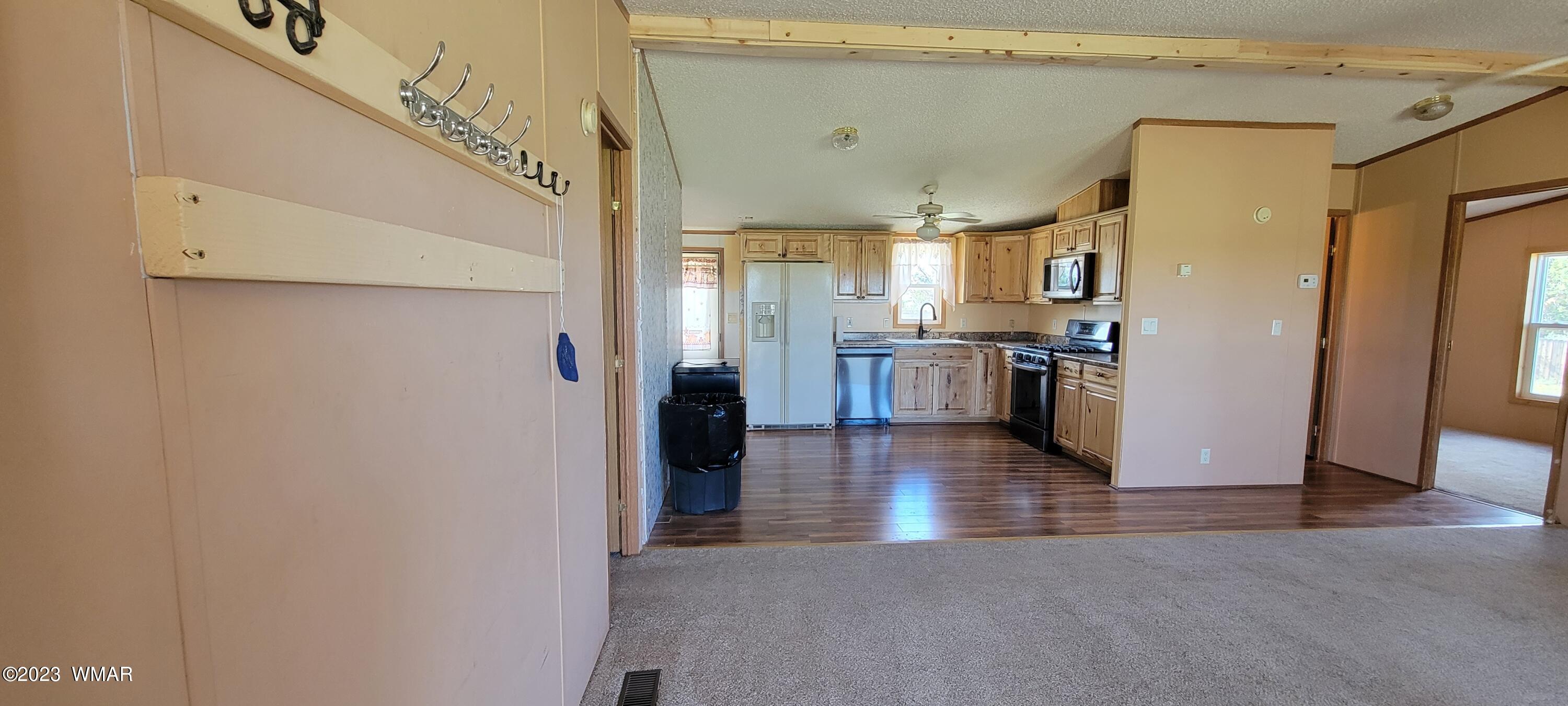 4732 Norris Road Snowflake, AZ 85937 - Photo 4 of 67 a view of a kitchen with a refrigerator a stove top oven a sink and dishwasher