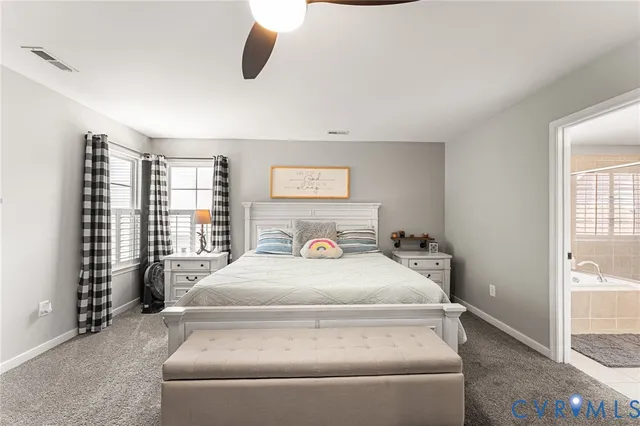 a large white bed in a white room