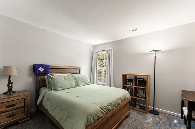 a bedroom with a bed and a closet