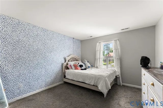 a bedroom with a bed and a window in it