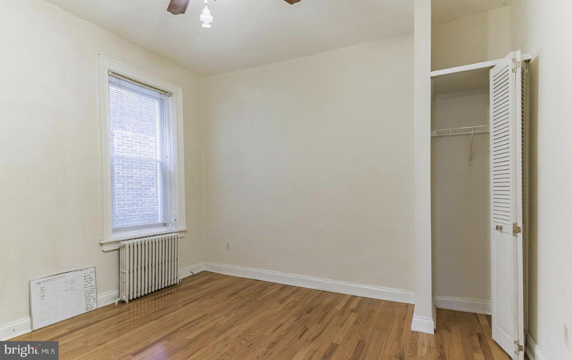 220 South 53rd Street Philadelphia, PA 19139 - Photo 11 of 15 an empty room with wooden floor and windows