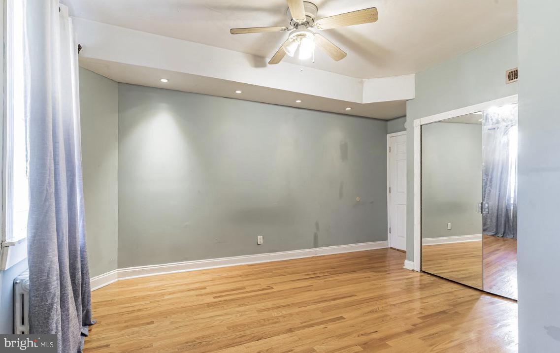 220 South 53rd Street Philadelphia, PA 19139 - Photo 7 of 15 a view of an empty room with wooden floor and a window