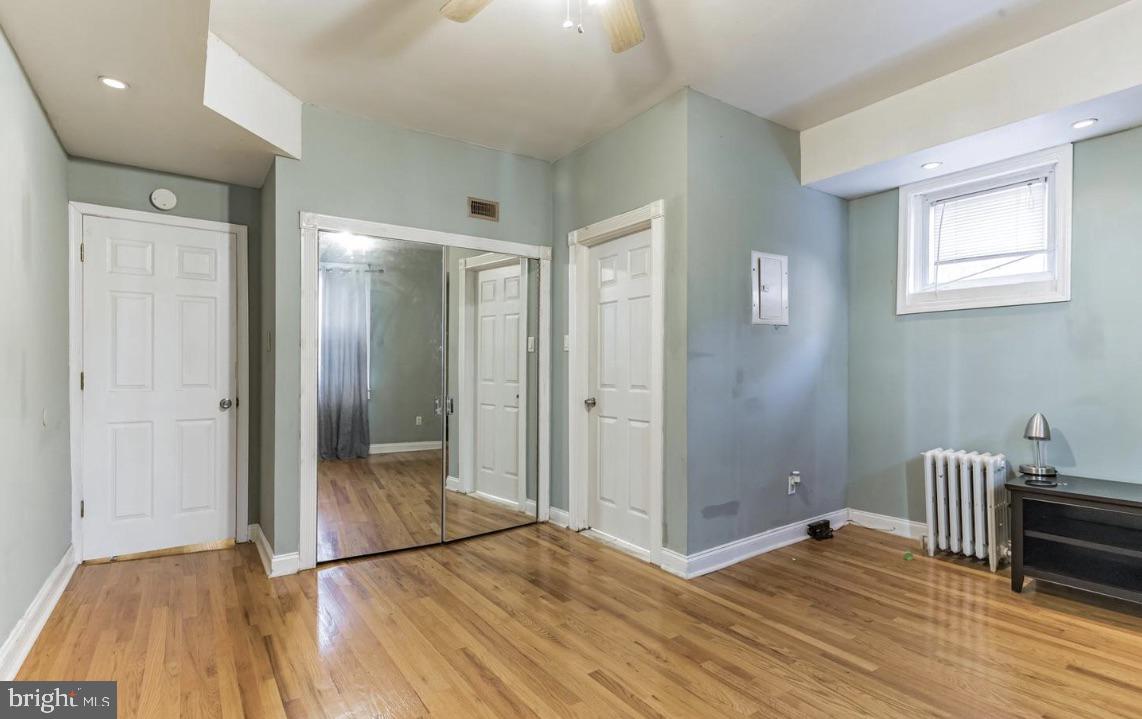 220 South 53rd Street Philadelphia, PA 19139 - Photo 9 of 15 a view of a hallway with wooden floor and staircase