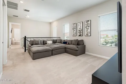 a view of a swimming pool with an outdoor space and seating area