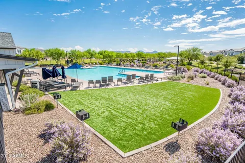 a front view of a house with a yard and an outdoor seating