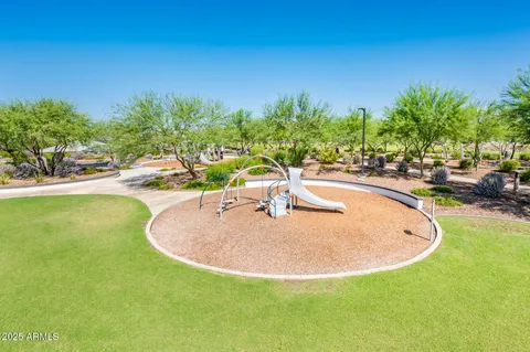 a room with gym equipment and a flat screen tv