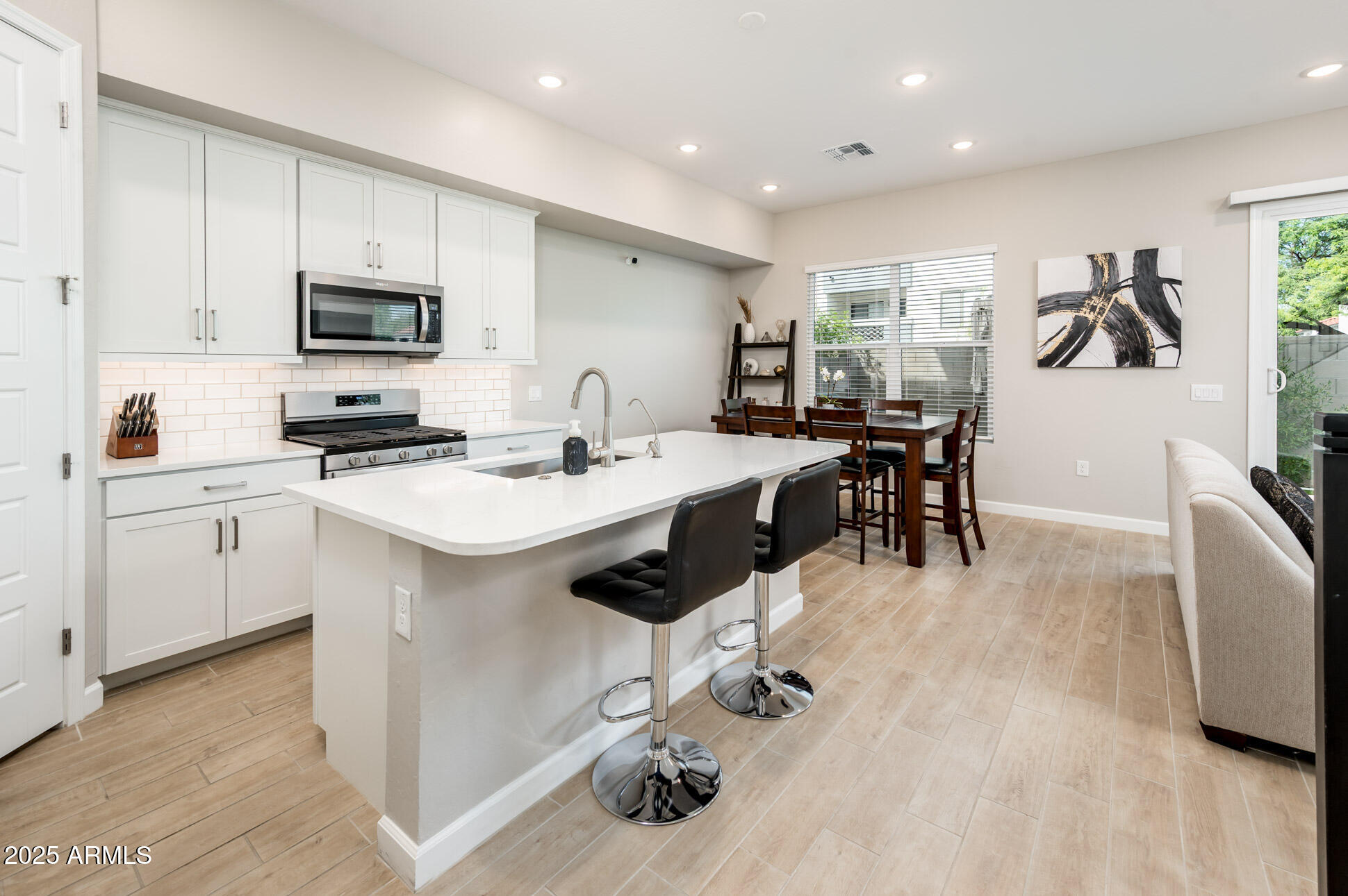 17146 North 50th Street Scottsdale, AZ 85254 - Photo 2 of 51 a kitchen with a sink appliances and cabinets
