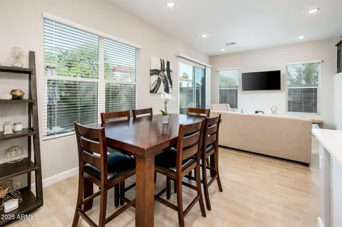 a bathroom with a double vanity sink a large mirror and shower