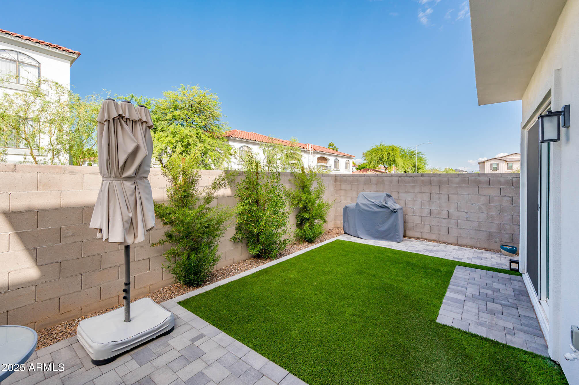 17146 North 50th Street Scottsdale, AZ 85254 - Photo 5 of 51 a view of a backyard with table and chairs potted plants