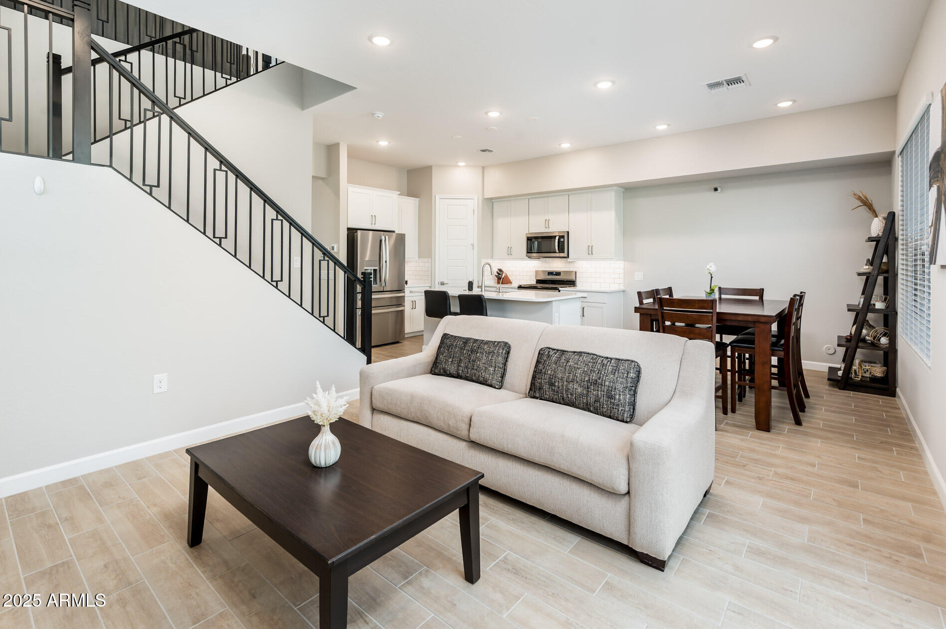 17146 North 50th Street Scottsdale, AZ 85254 - Photo 8 of 51 a living room with furniture kitchen view and a dining table