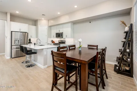 a view of a swimming pool with an outdoor seating and a garden