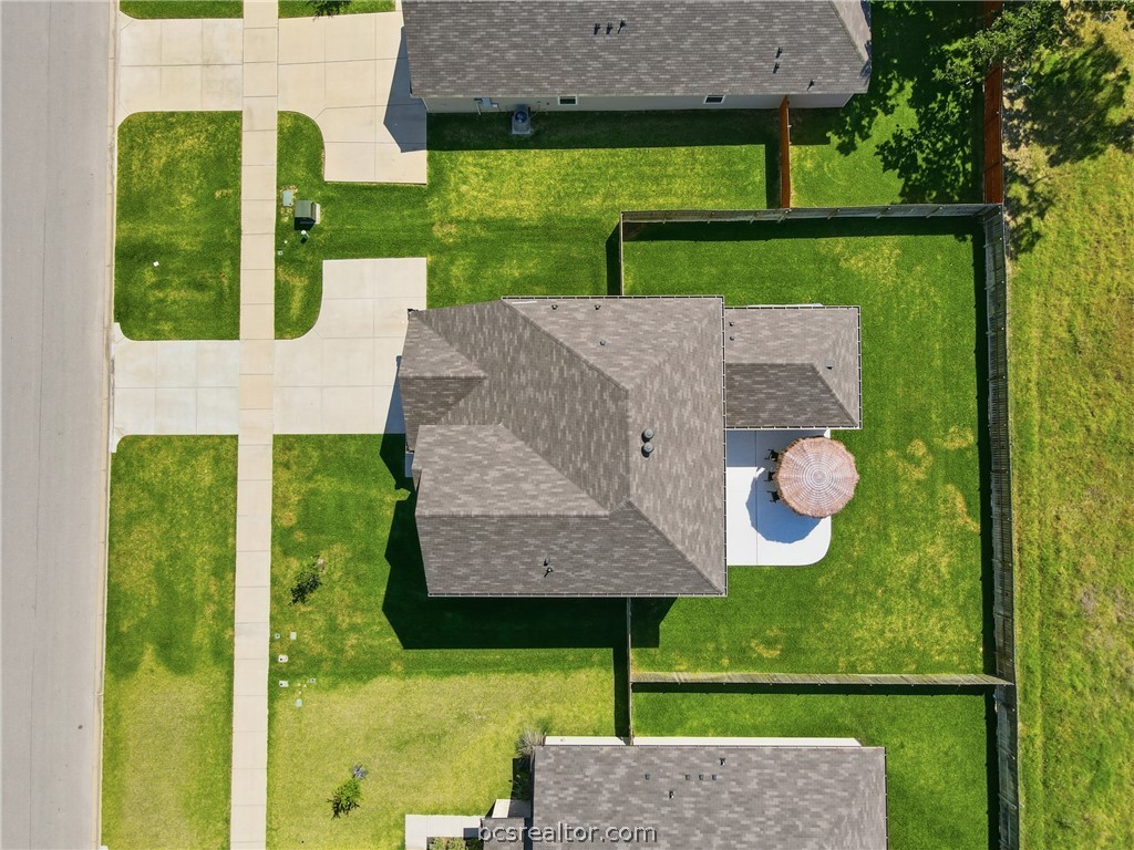 1922 Viva Road Bryan, TX 77807 - Photo 2 of 45 Stunning aerial perspective showcasing rare privacy with no rear neighbors and ranch views behind the home.