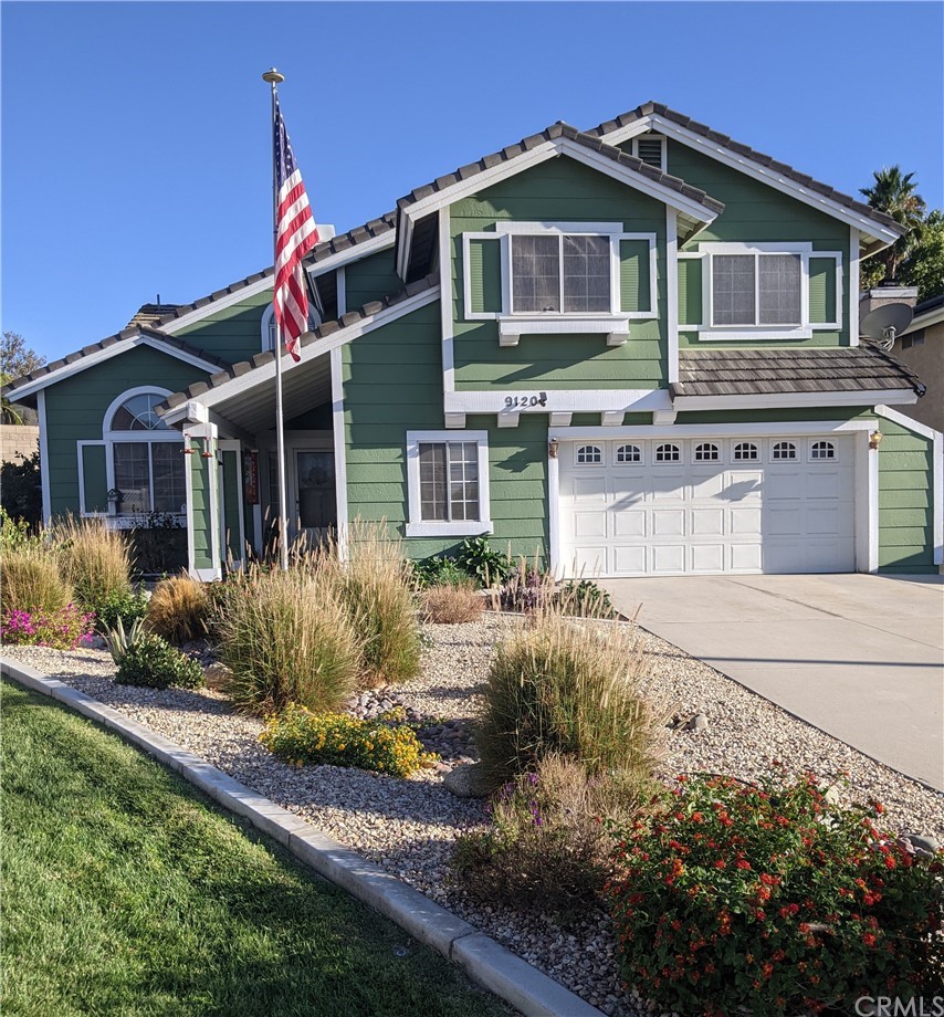 9120 Ewing Circle Riverside, CA 92508 - Photo 1 of 1 a front view of a house with a yard
