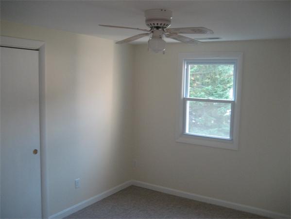 7 Hatfield Road Hamilton, MA 01982 - Photo 12 of 14 an empty room with a window and a fan