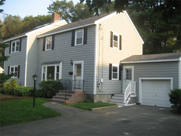 7 Hatfield Road Hamilton, MA 01982 - Photo 2 of 14 a view of a house with a yard and a garage
