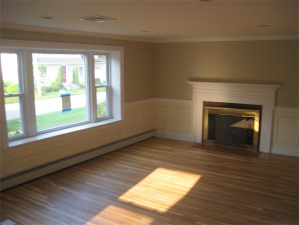 7 Hatfield Road Hamilton, MA 01982 - Photo 5 of 14 a view of empty room with wooden floor and fireplace