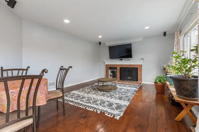 a living room with furniture fireplace and flat screen tv