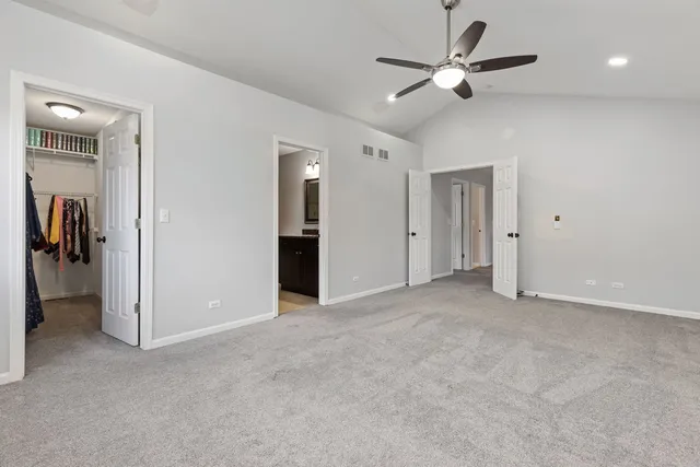 a view of empty room with ceiling fan
