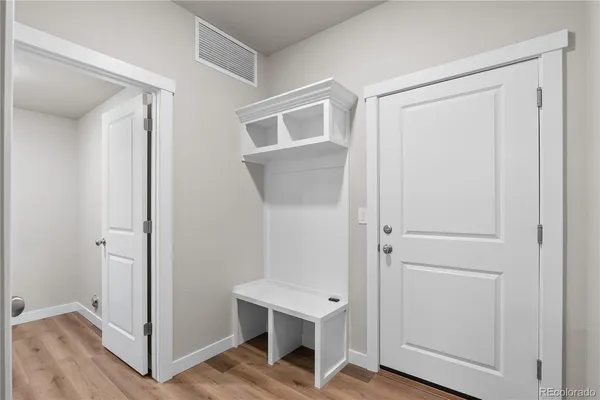 a view of a hallway with bathroom