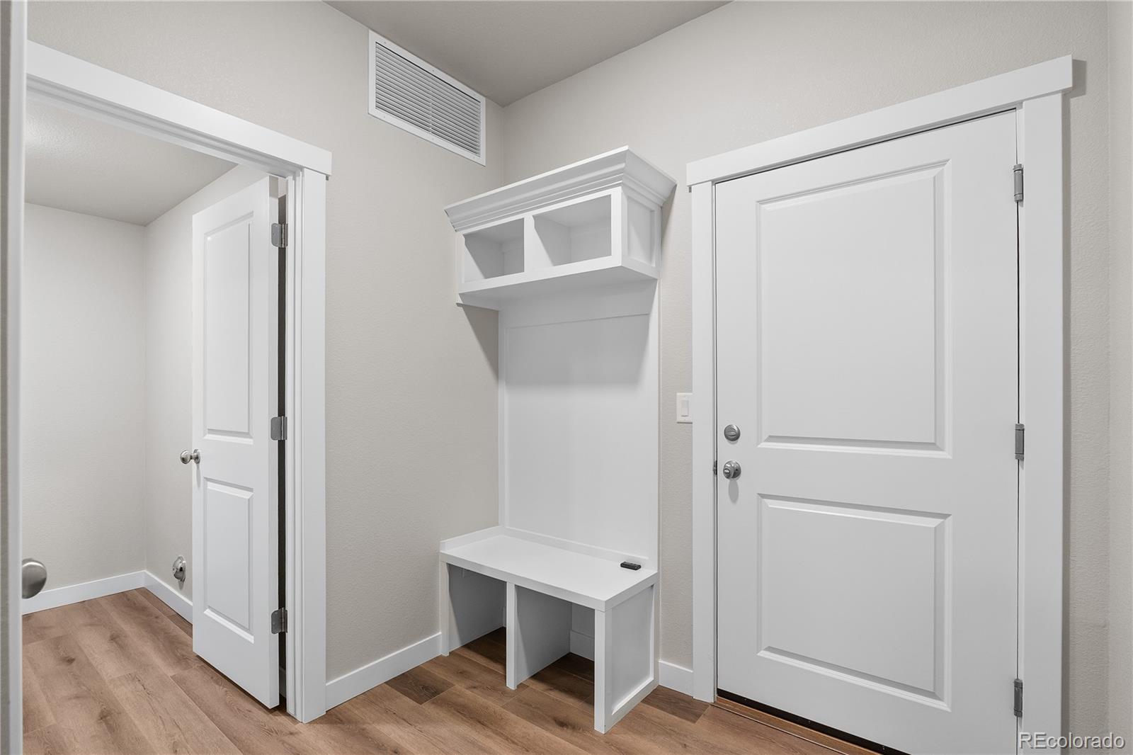 350 High Point Drive, Unit C103 Longmont, CO 80504 - Photo 11 of 25 a view of a hallway with bathroom