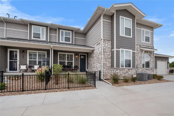 a front view of a house with a outdoor space