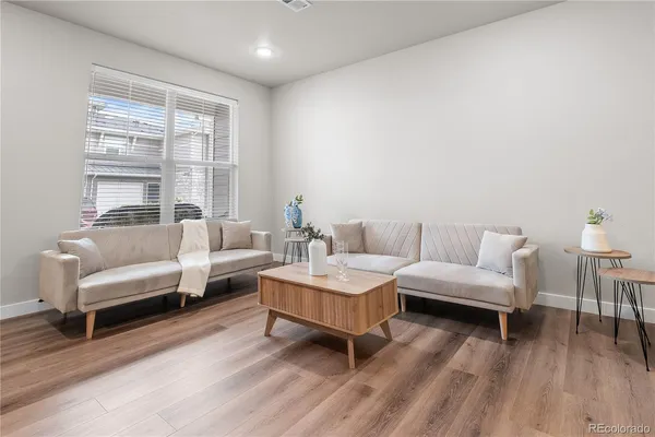 a living room with furniture and a large window