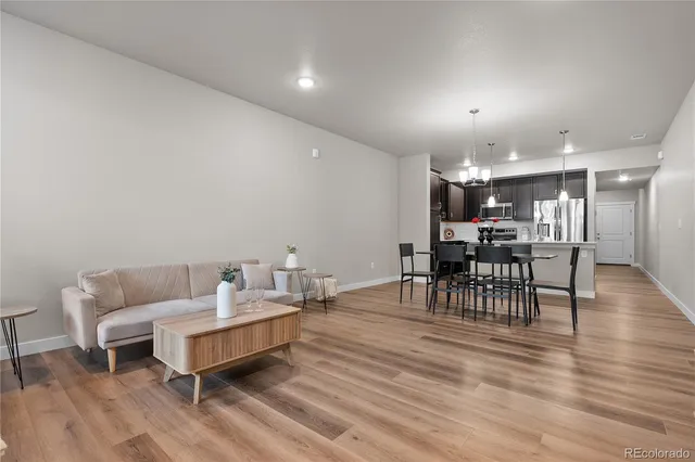 a living room with furniture and a table