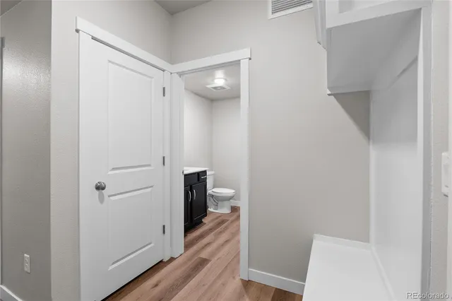 a view of a bathroom from a hallway